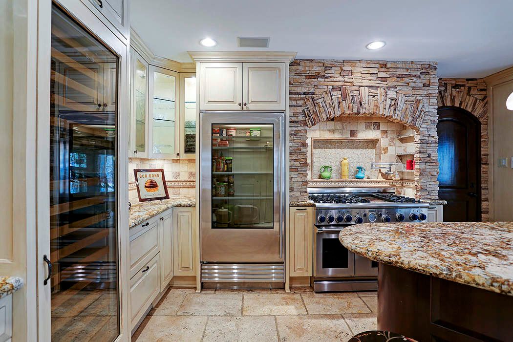 18 East Shady Lane Unit B Houston Tx 77063 Martha Turner There Are Pull Out E Racks By Cooktop And Oven Generous Cabinets Spaces Under Counter Lighting Two Sub Zero Freezer Drawers Plus Glass Front
